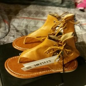 Sandals in cognac color leather